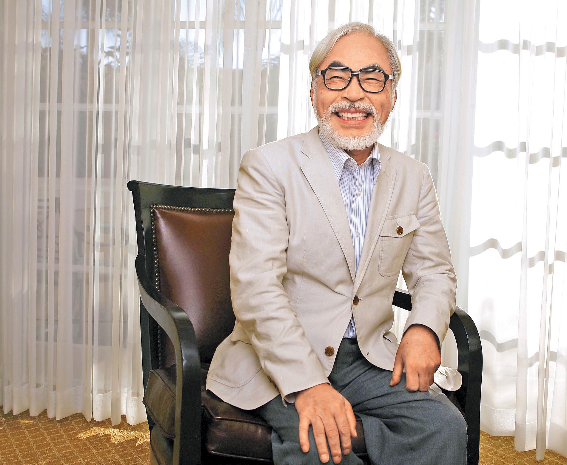 Japanese director Miyazaki of the animated movie "Ponyo" smiles as he poses for a picture in Los Angeles